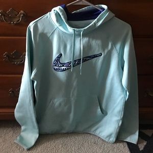Light blue Nike sweatshirt.